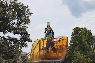 A colorful scene of a character leaping between floating islands under a bright blue sky.