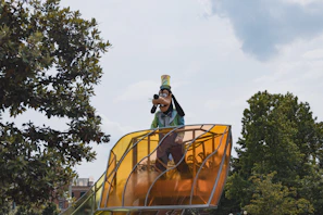 A lively platformer scene with a character jumping across floating islands under a sunny sky