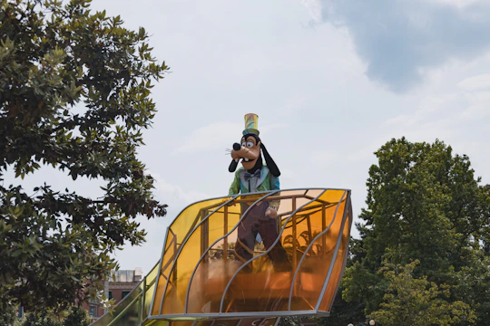 A colorful scene of a character leaping between floating islands under a bright blue sky.