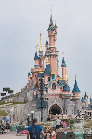 Bright, whimsical illustration of a child exploring a fairy-tale castle with their name glowing above.