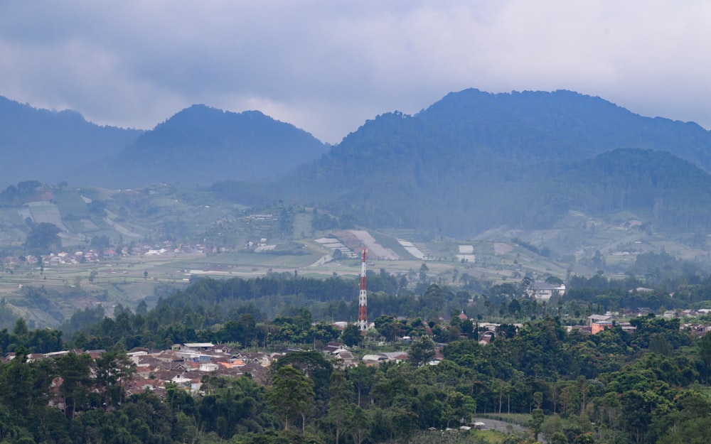 a view of a town in the middle of a mountain range