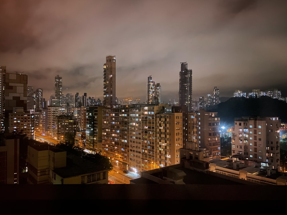 a view of a city at night from a rooftop