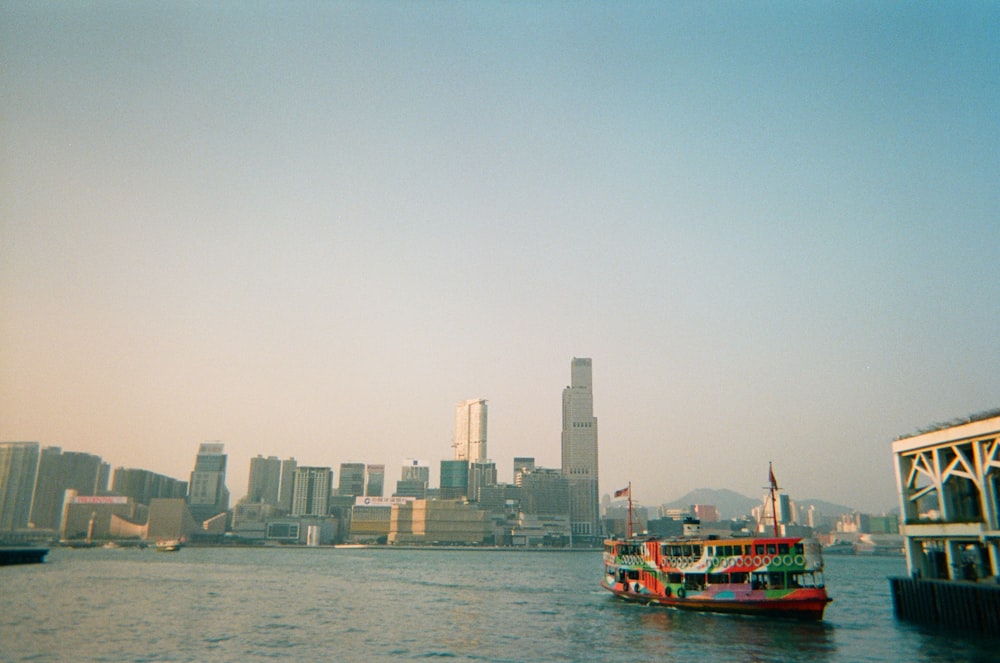 a red and white boat in a body of water