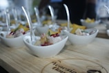 A colorful spread of various mezes in small bowls.