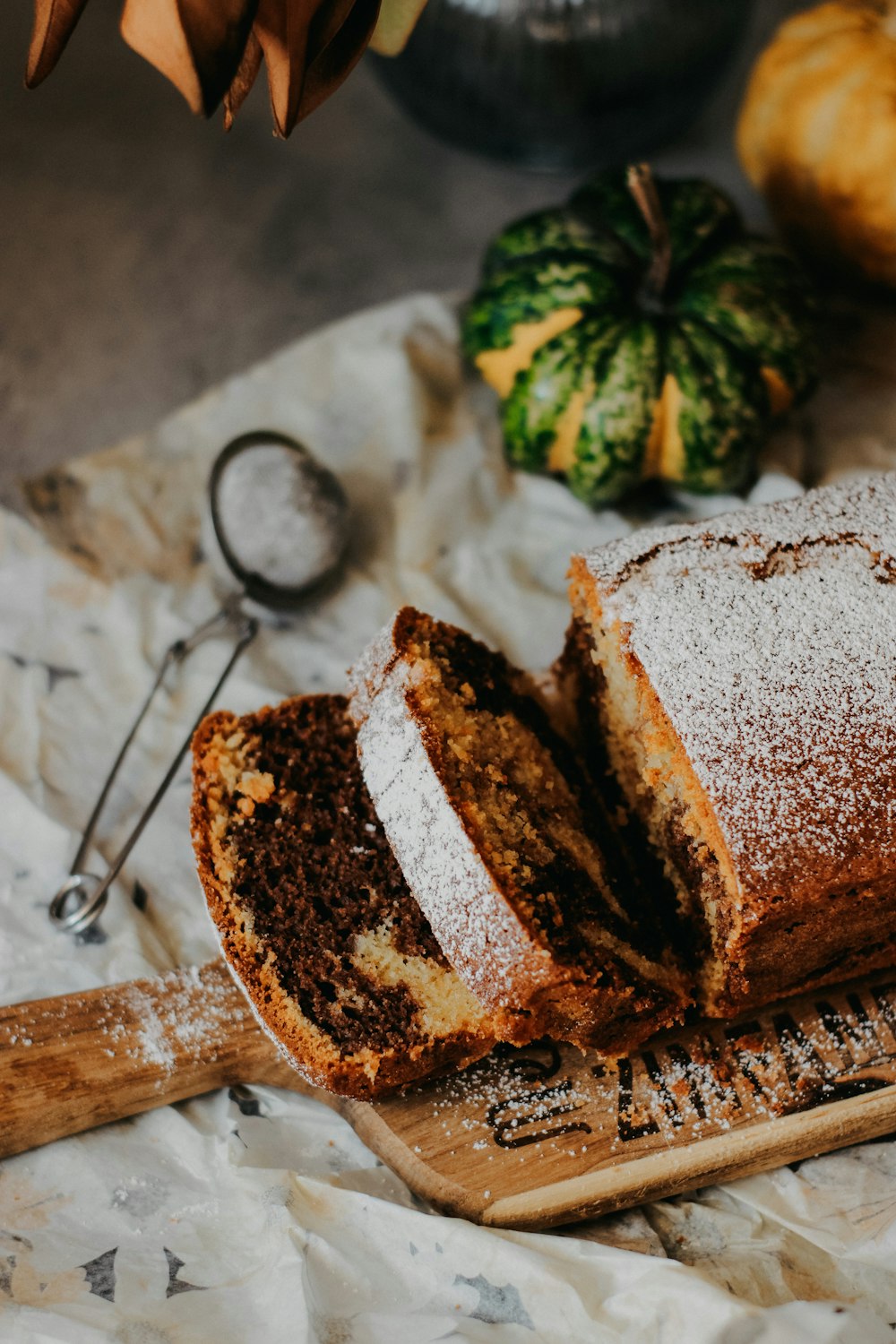 a loaf of cake sitting on top of a wooden cutting board