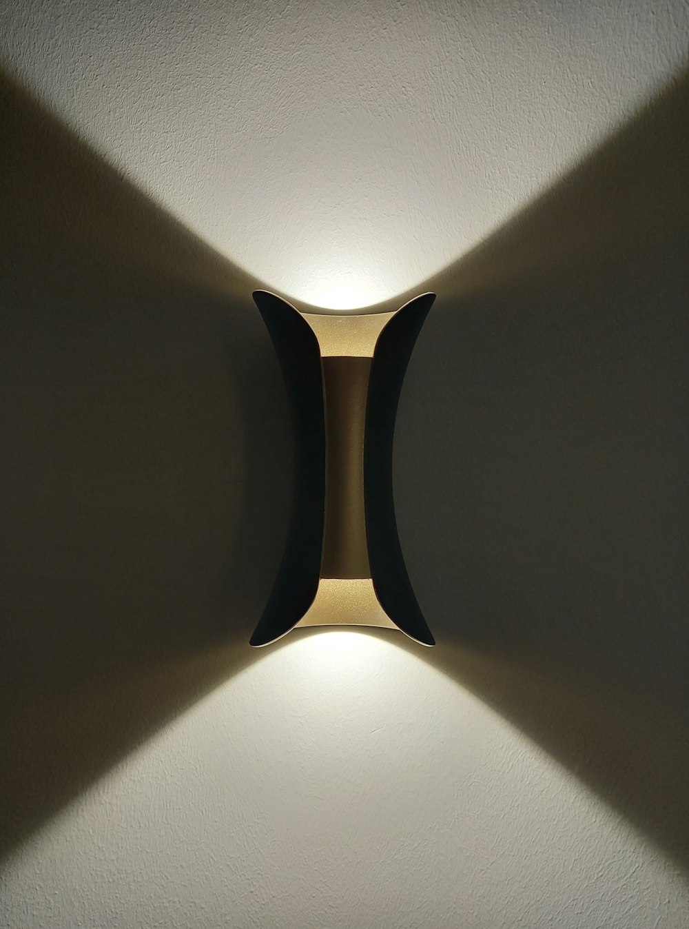a close up of a light on a wall