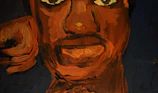 Close-up shot of a punk rocker painting a haunted forest scene with vivid orange highlights.
