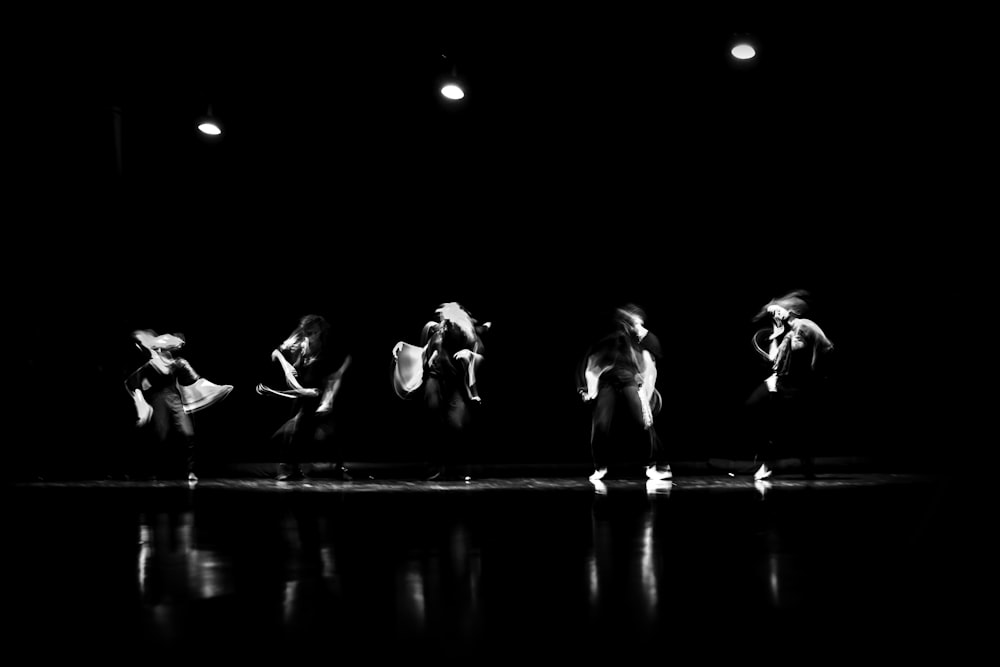 a group of people standing on top of a stage