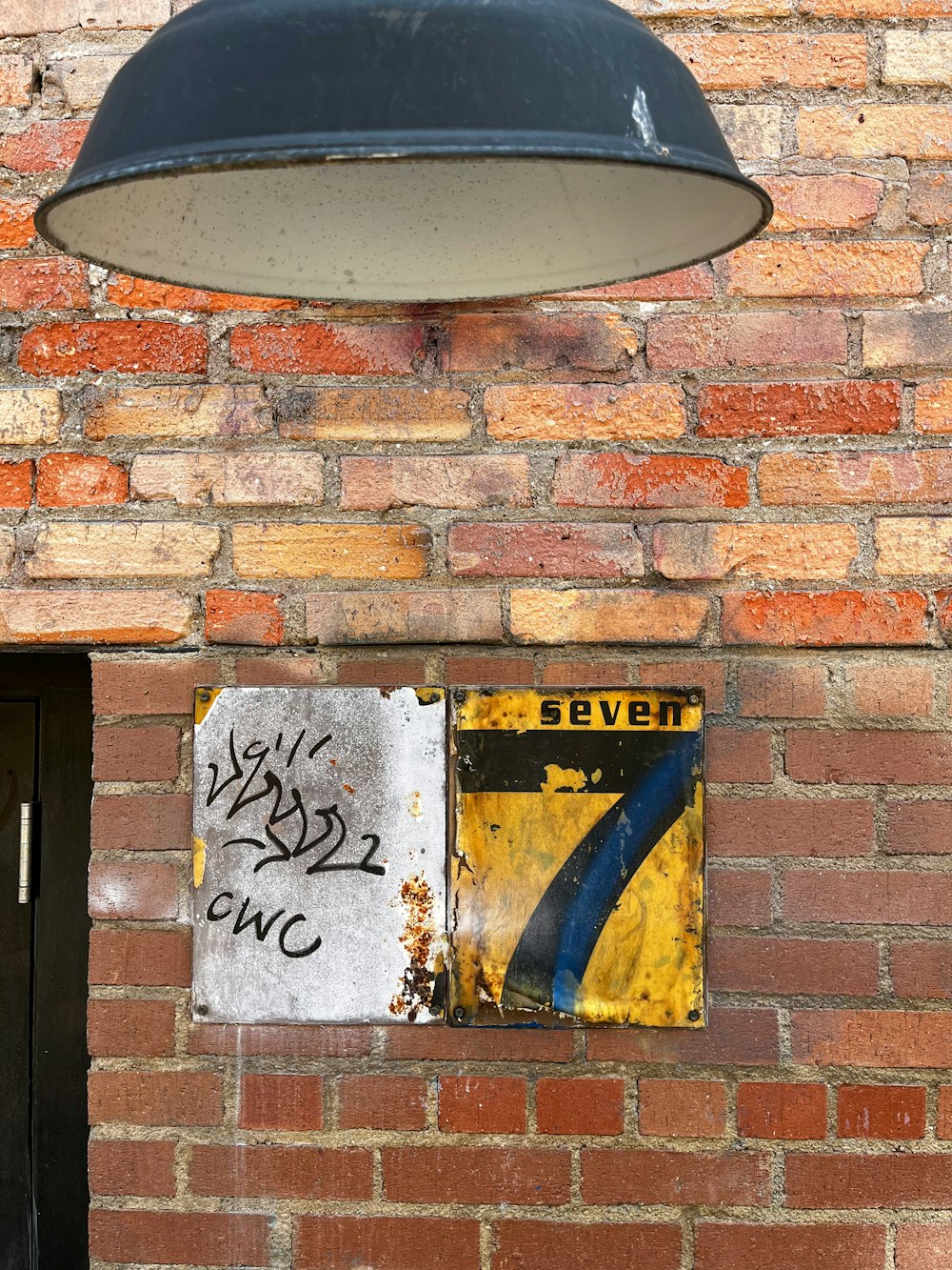 a brick wall with a sign on it