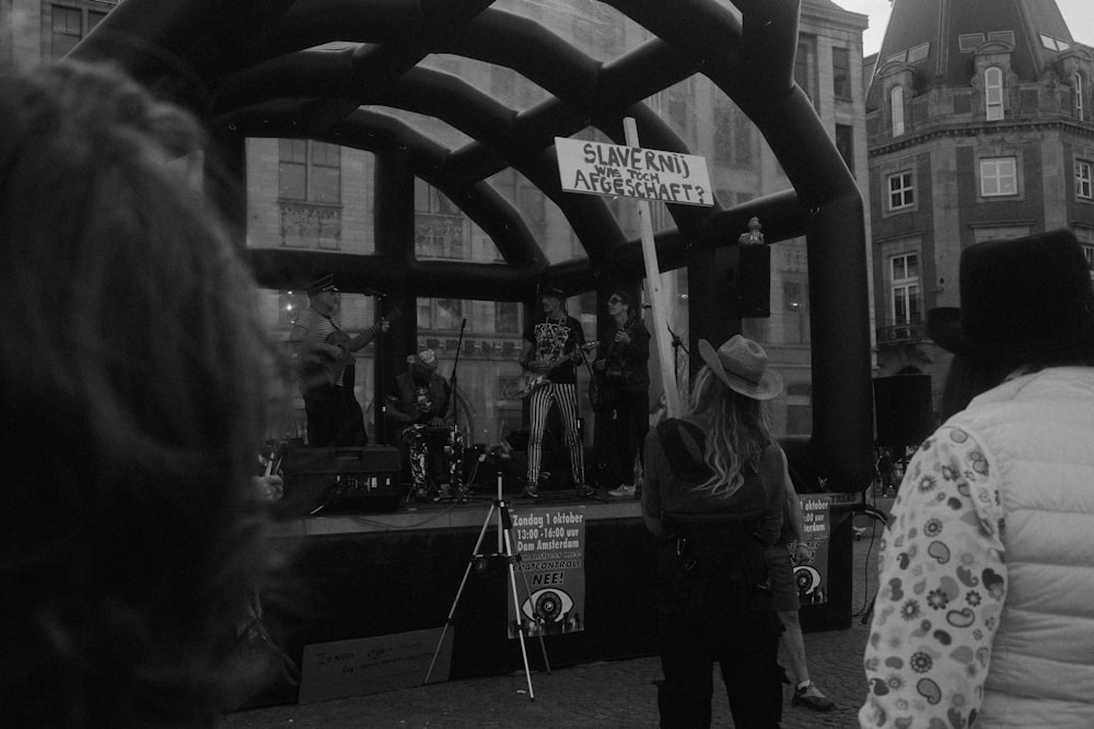 a group of people that are standing in the street