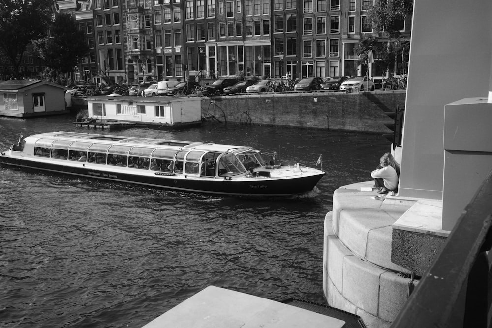 a black and white photo of a boat in the water