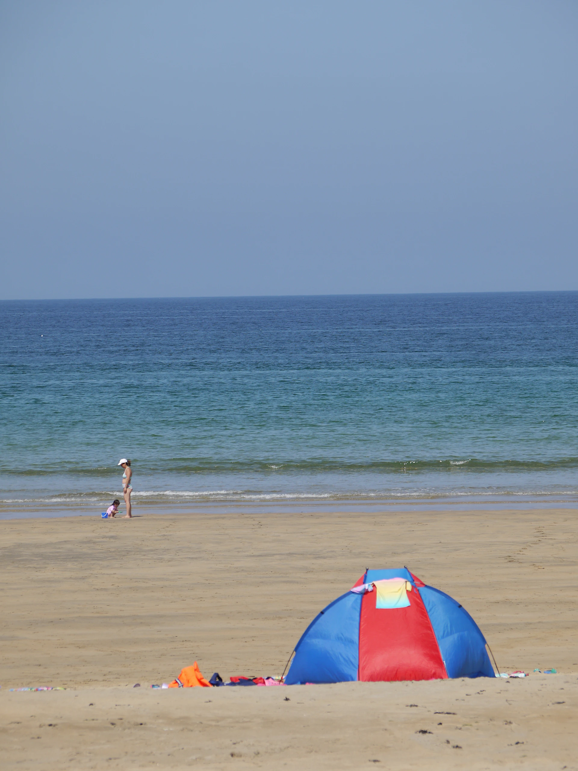 woman wearing yellow long-sleeved dress under white clouds and blue sky during daytime