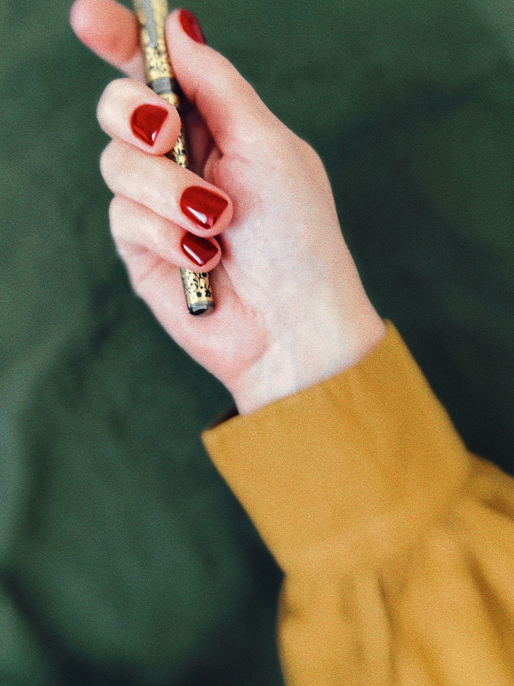 a woman holding a cell phone in her hand