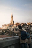 Iconic European landmarks with travelers checking their phones.