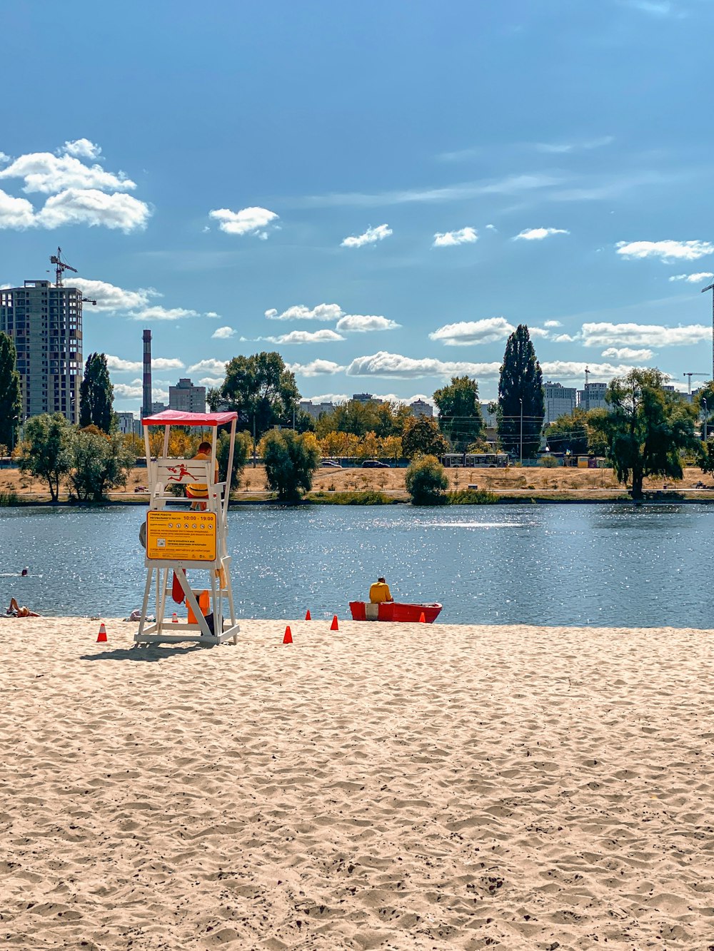 a lifeguard stand on a beach near a body of water