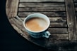A steaming cup of Honduran coffee on a rustic table.