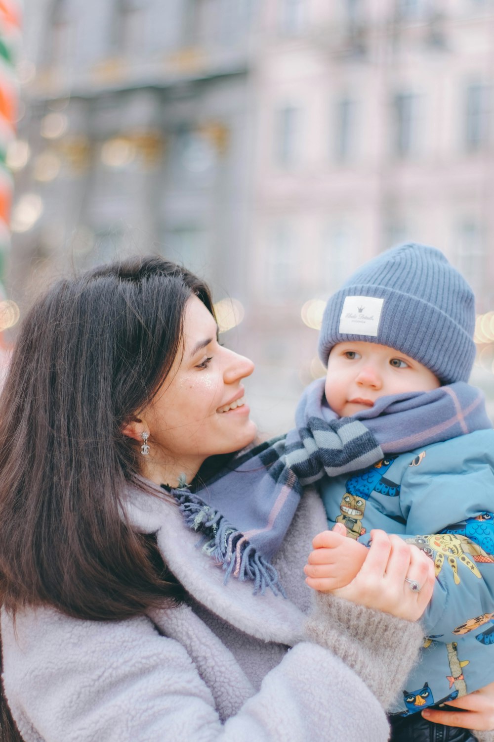 a woman holding a baby in her arms