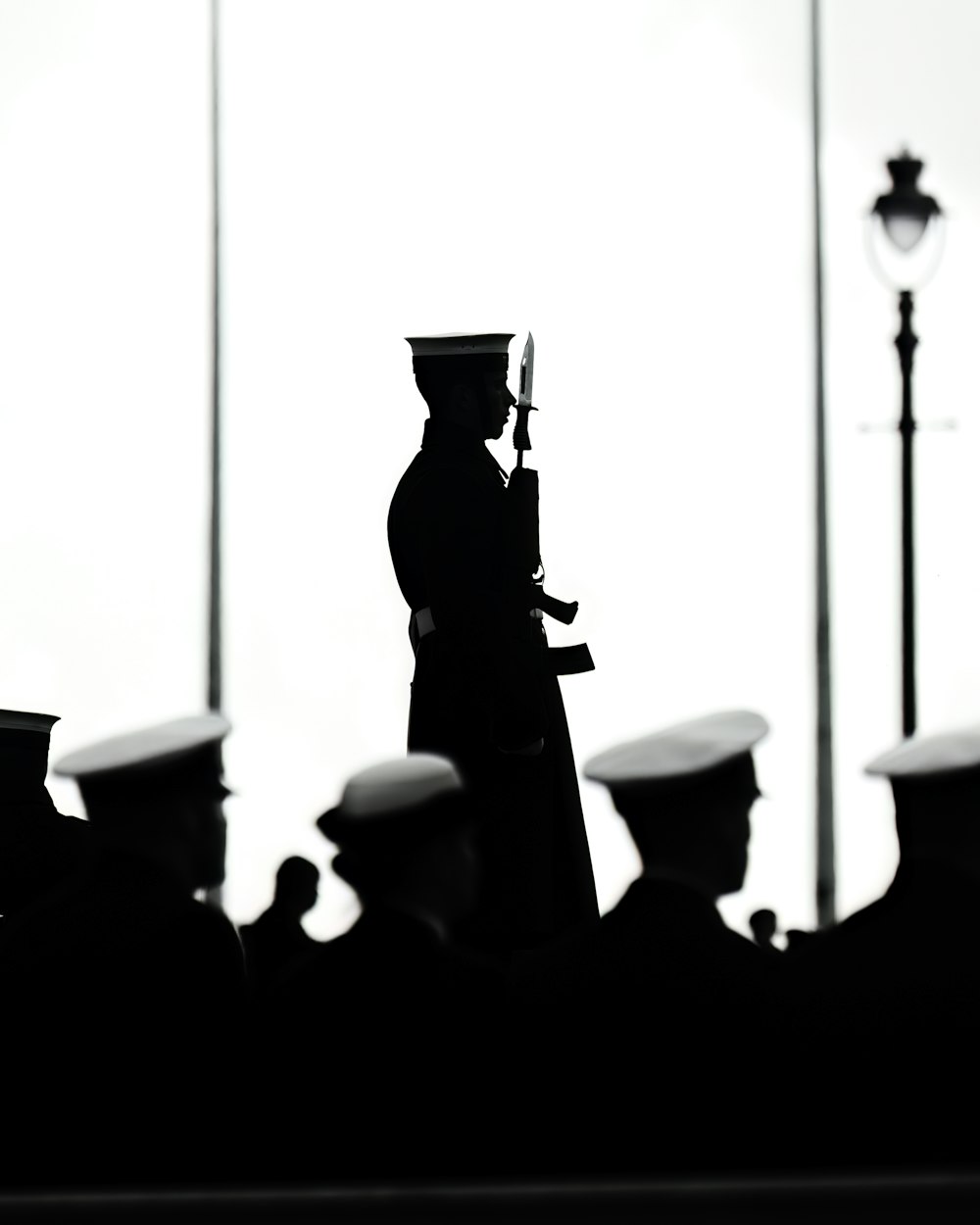 a black and white photo of a group of men in uniform