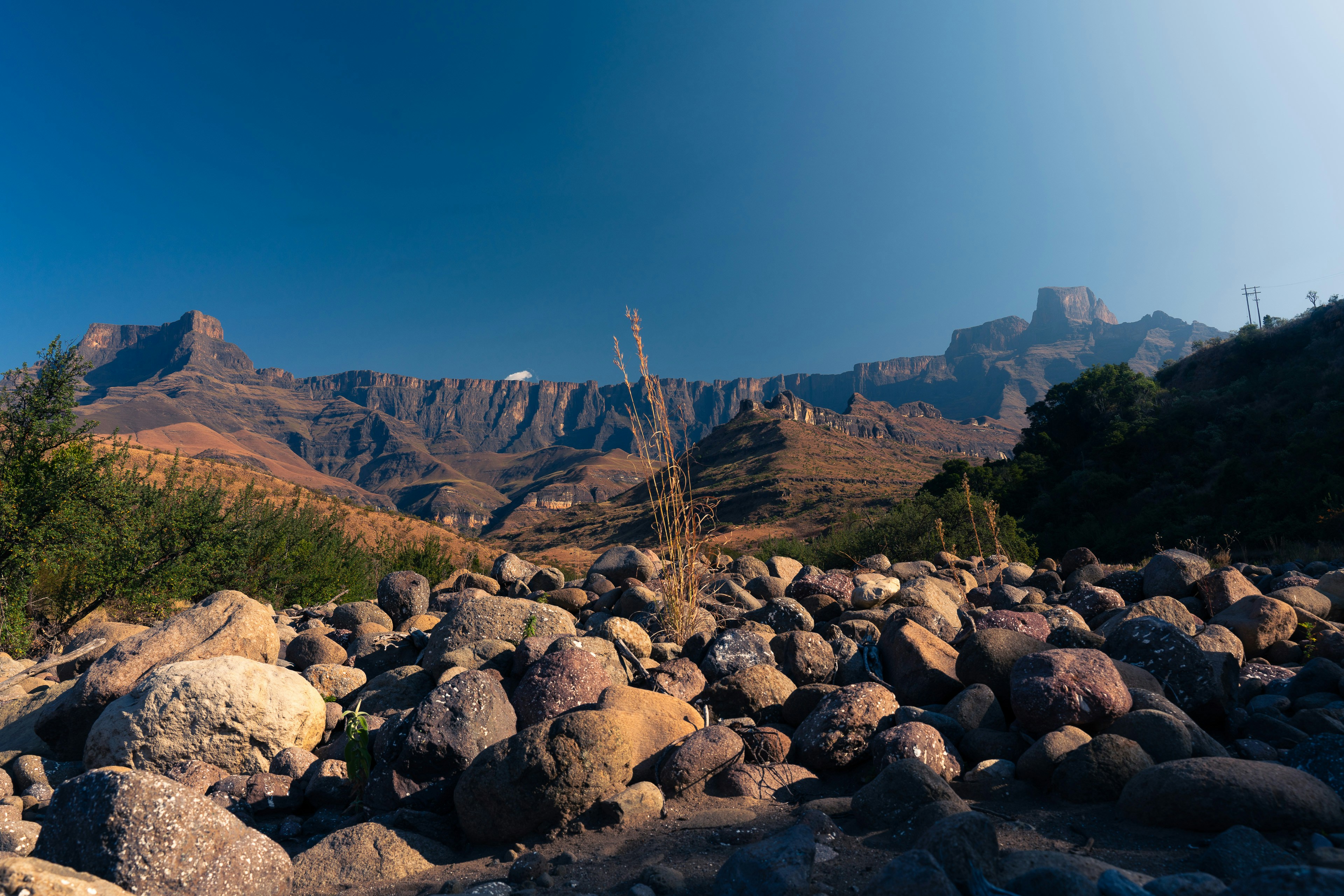 a view of a mountain range from a rocky area