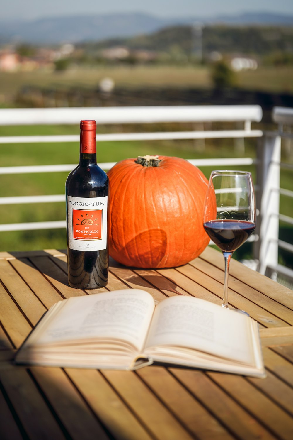 a bottle of wine and a glass of wine on a table