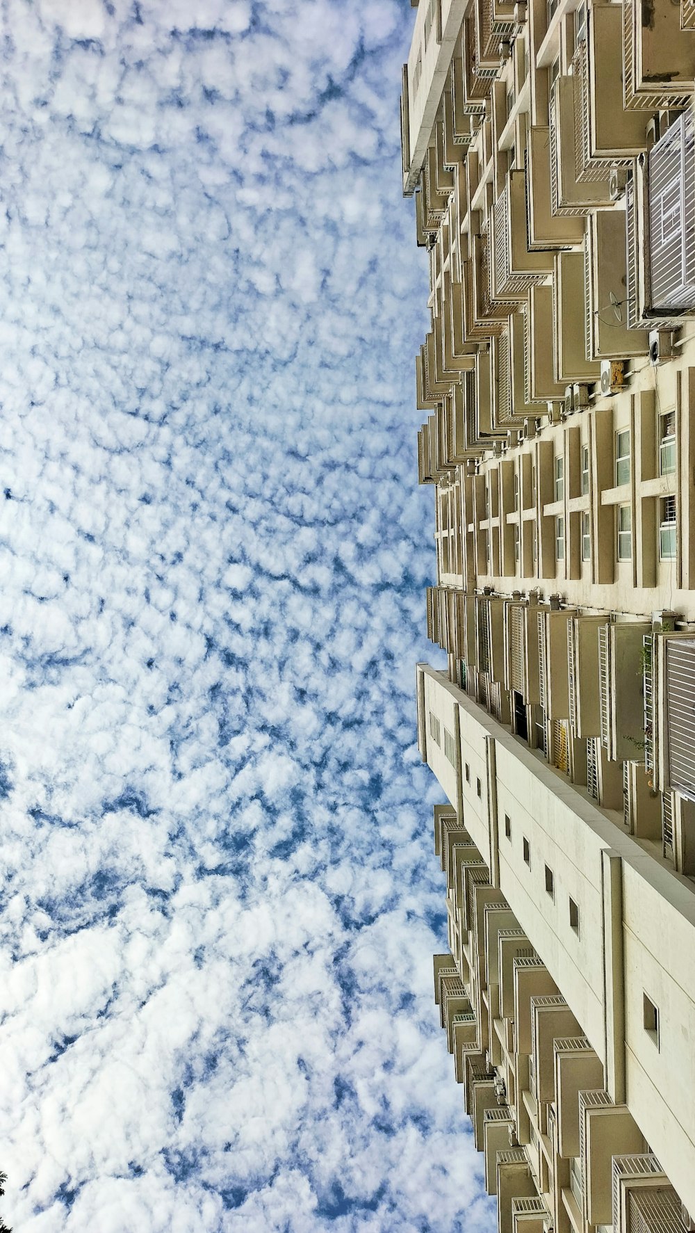 a very tall building with a sky in the background