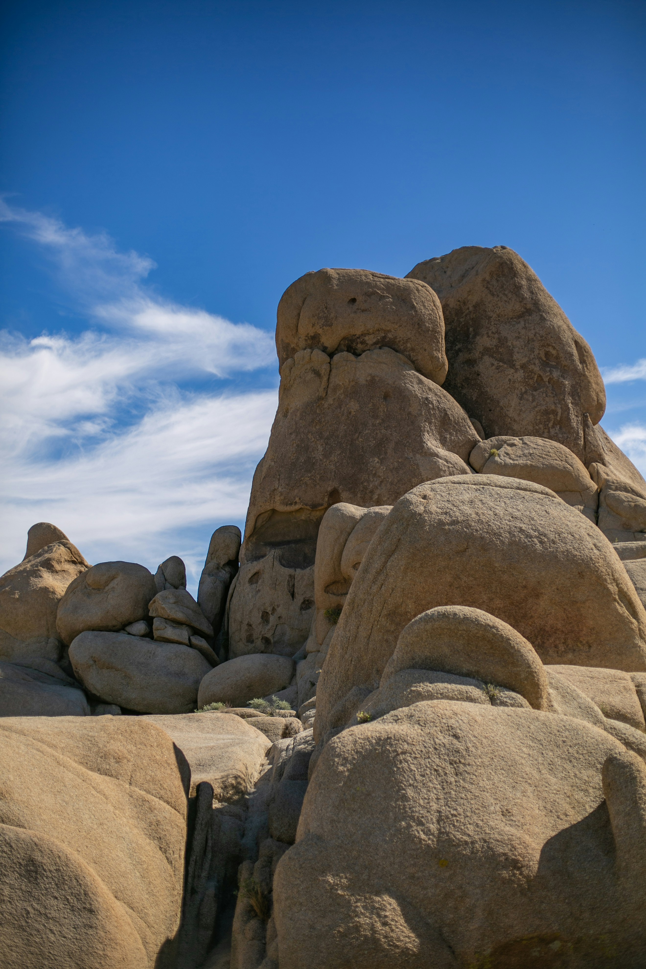 a large rock formation in the middle of a desert