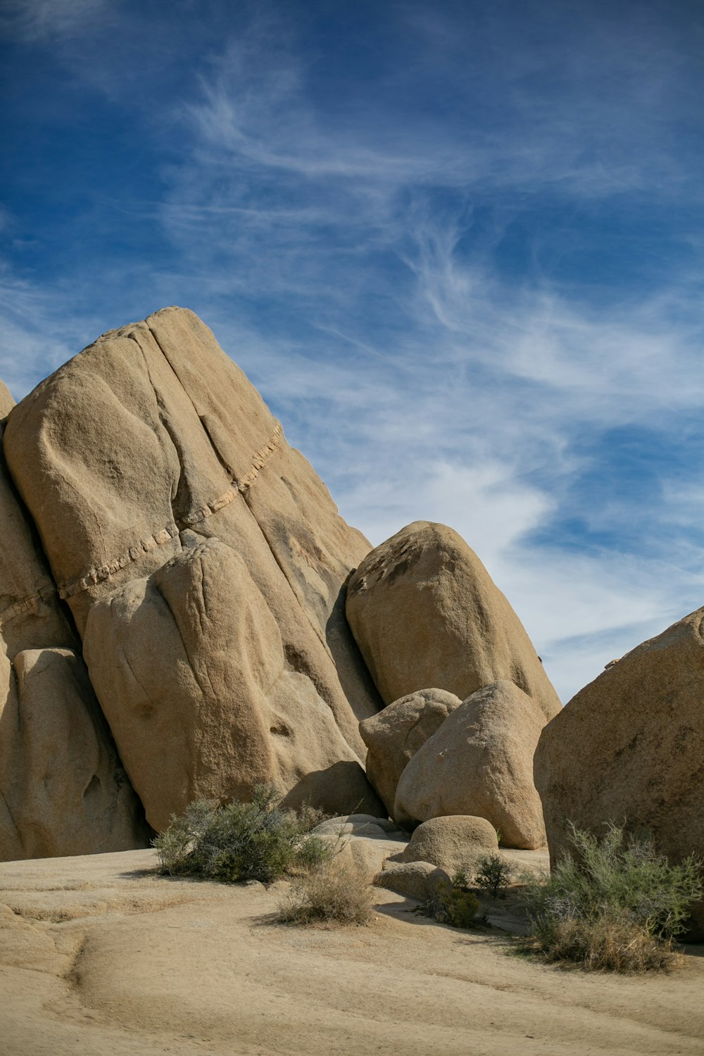 a large rock formation in the middle of a desert