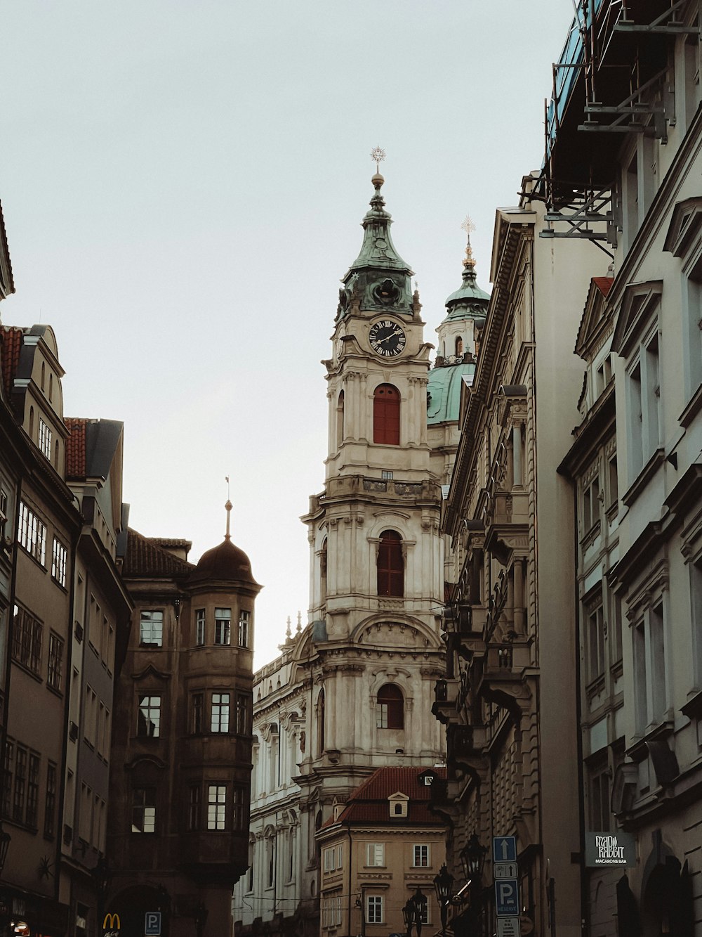 a tall building with a clock on the top of it