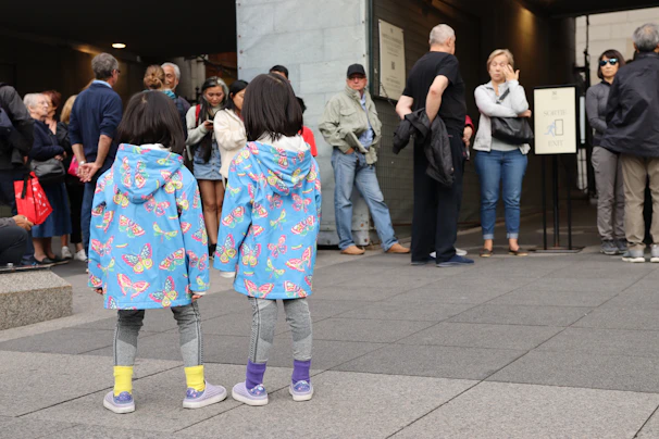 A group of children showing off flexty jackets on a breezy autumn afternoon.