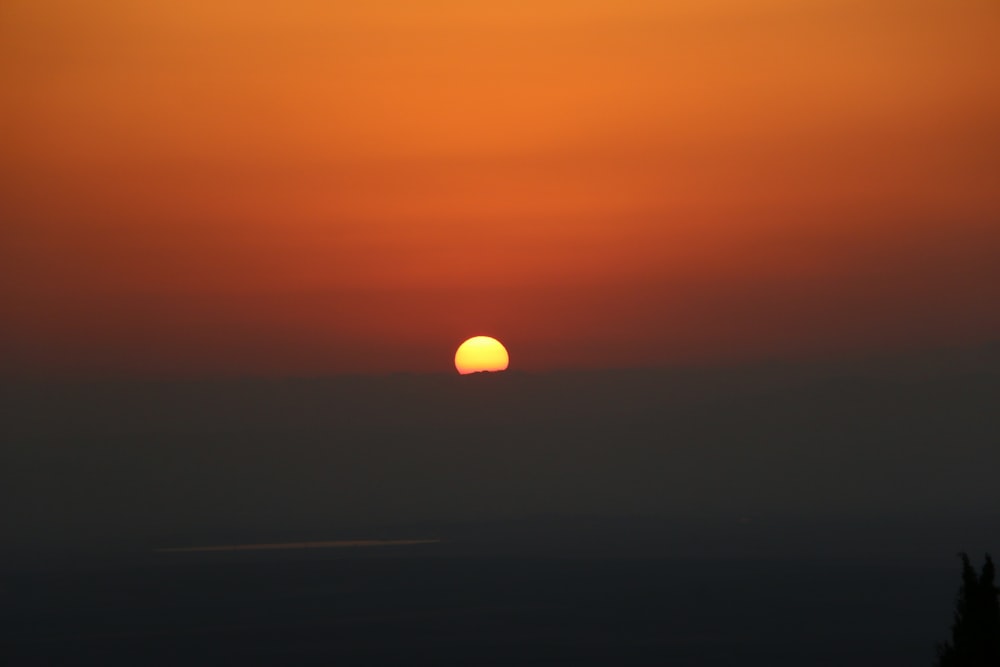 the sun is setting over the horizon of the horizon