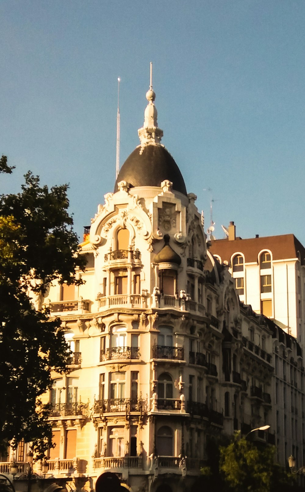 a tall building with a clock on the top of it