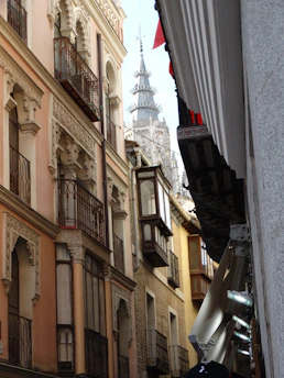 A vibrant street in Córdoba with small businesses and local shops.
