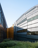 Corporate institutional building with sleek architecture and green landscaping.