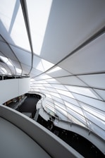 A professional reviewing architectural trend reports in a modern office.