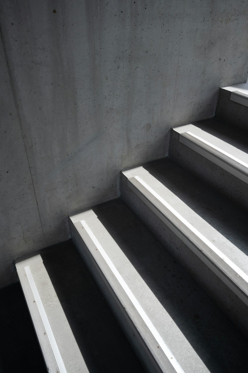 a set of concrete stairs leading up to a window