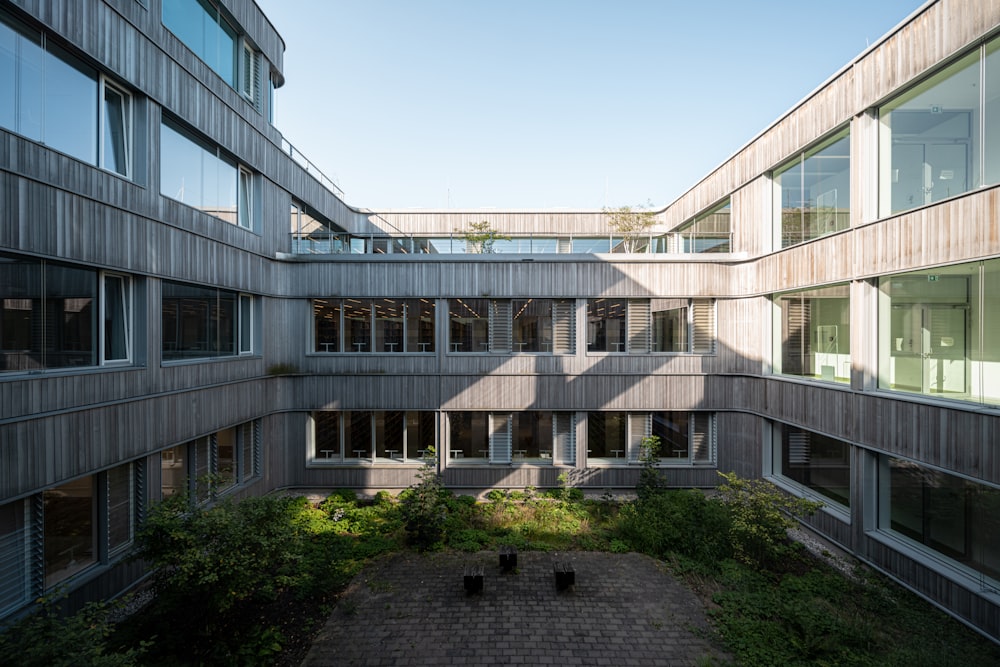 a courtyard in a building with several windows