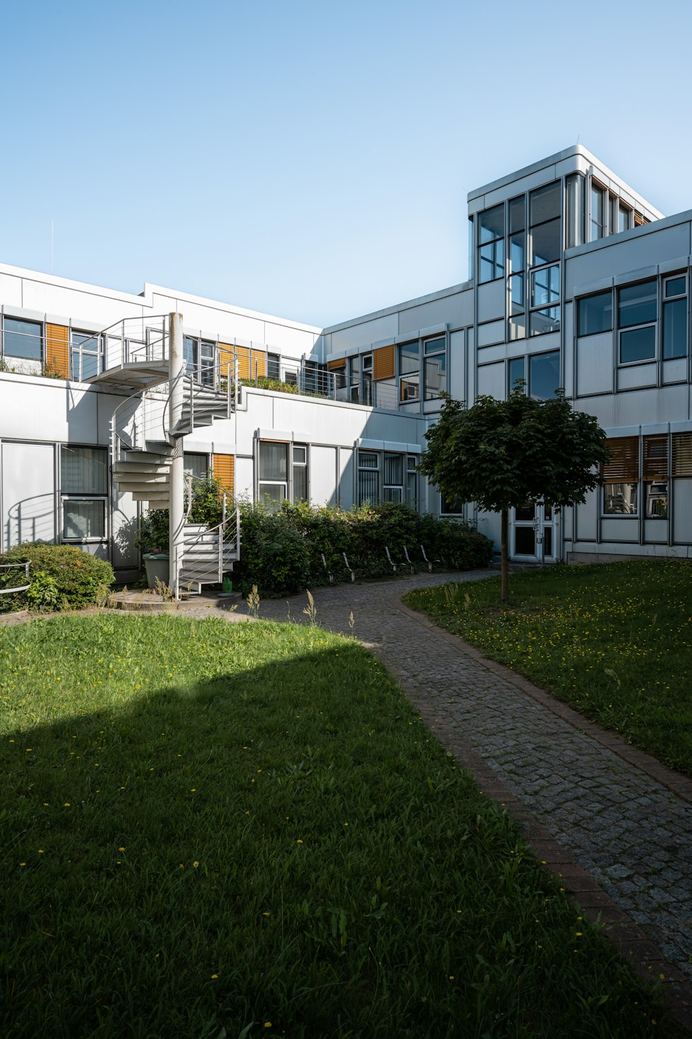 a building with a spiral staircase in front of it