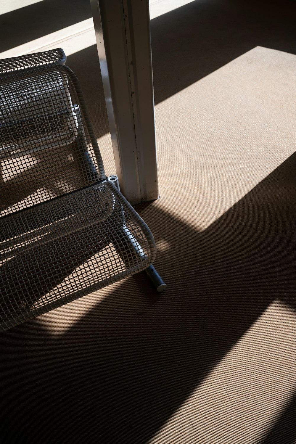 a chair sitting in a room next to a door