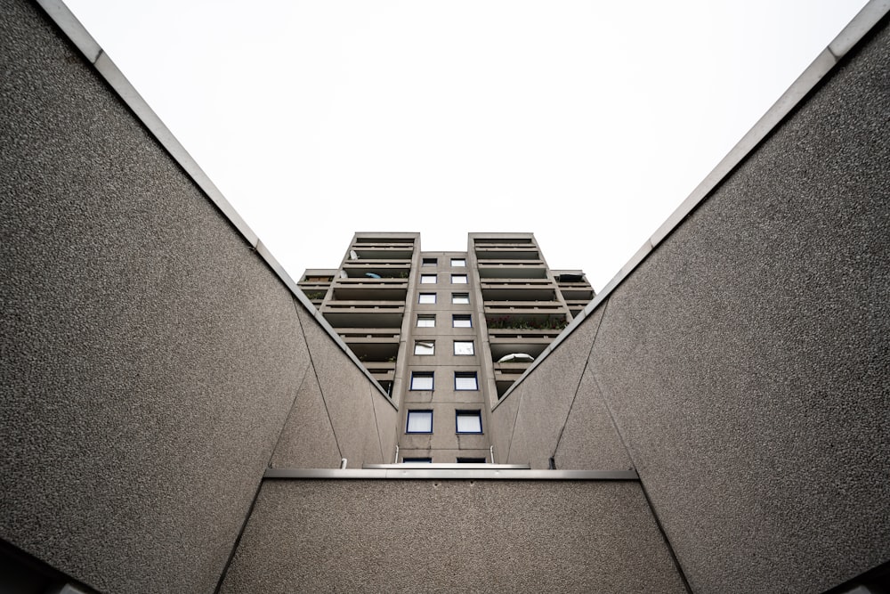 looking up at a tall building from the ground