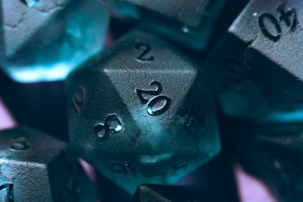 a close up of a metal dice with numbers on it