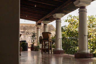 a patio with chairs and a table on it
