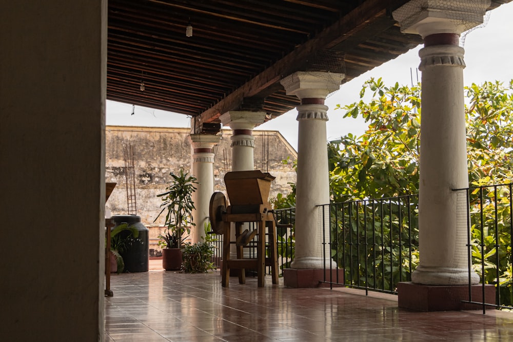 a patio with chairs and a table on it