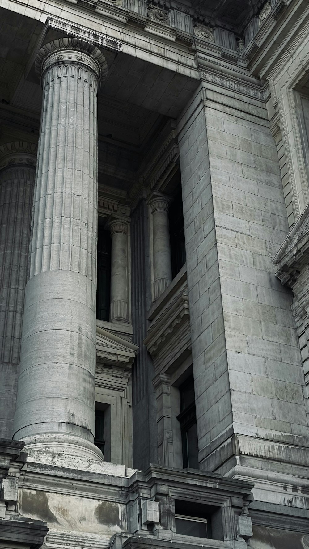 an old building with columns and a clock