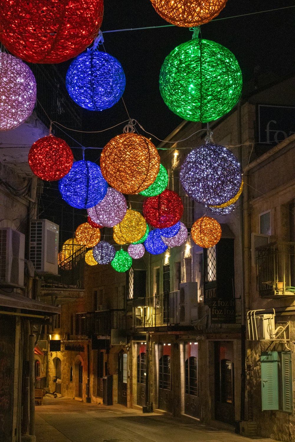 a city street filled with lots of colorful lights