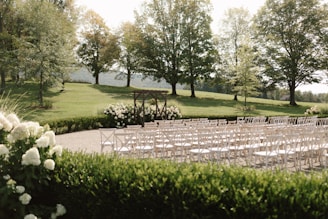 rows of chairs set up for an outdoor ceremony