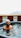 Photo of a happy customer standing next to their hot tub in Portland.