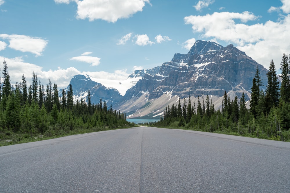 a road with a mountain in the background