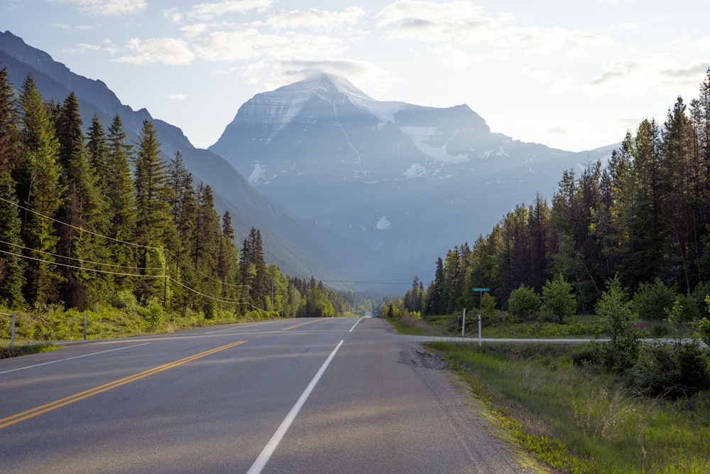 a road with a mountain in the background