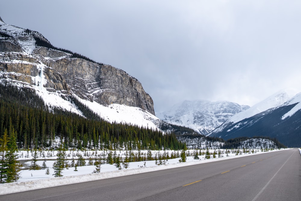 a road with a mountain in the background