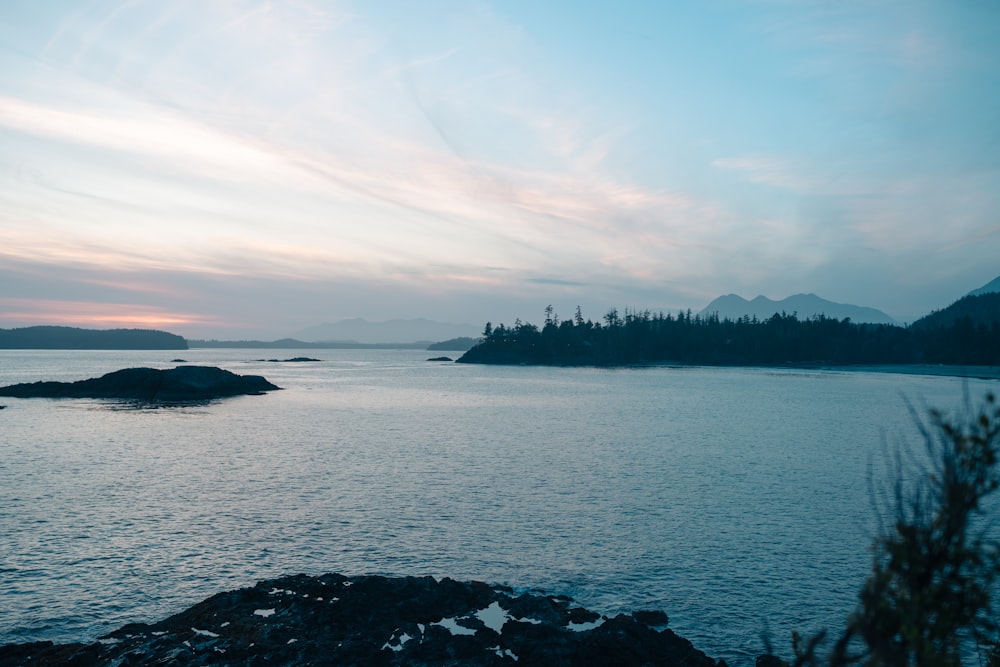 a body of water with a small island in the distance